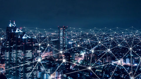 Digital network above city at night