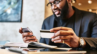Shot of african american businessman holding mobile
