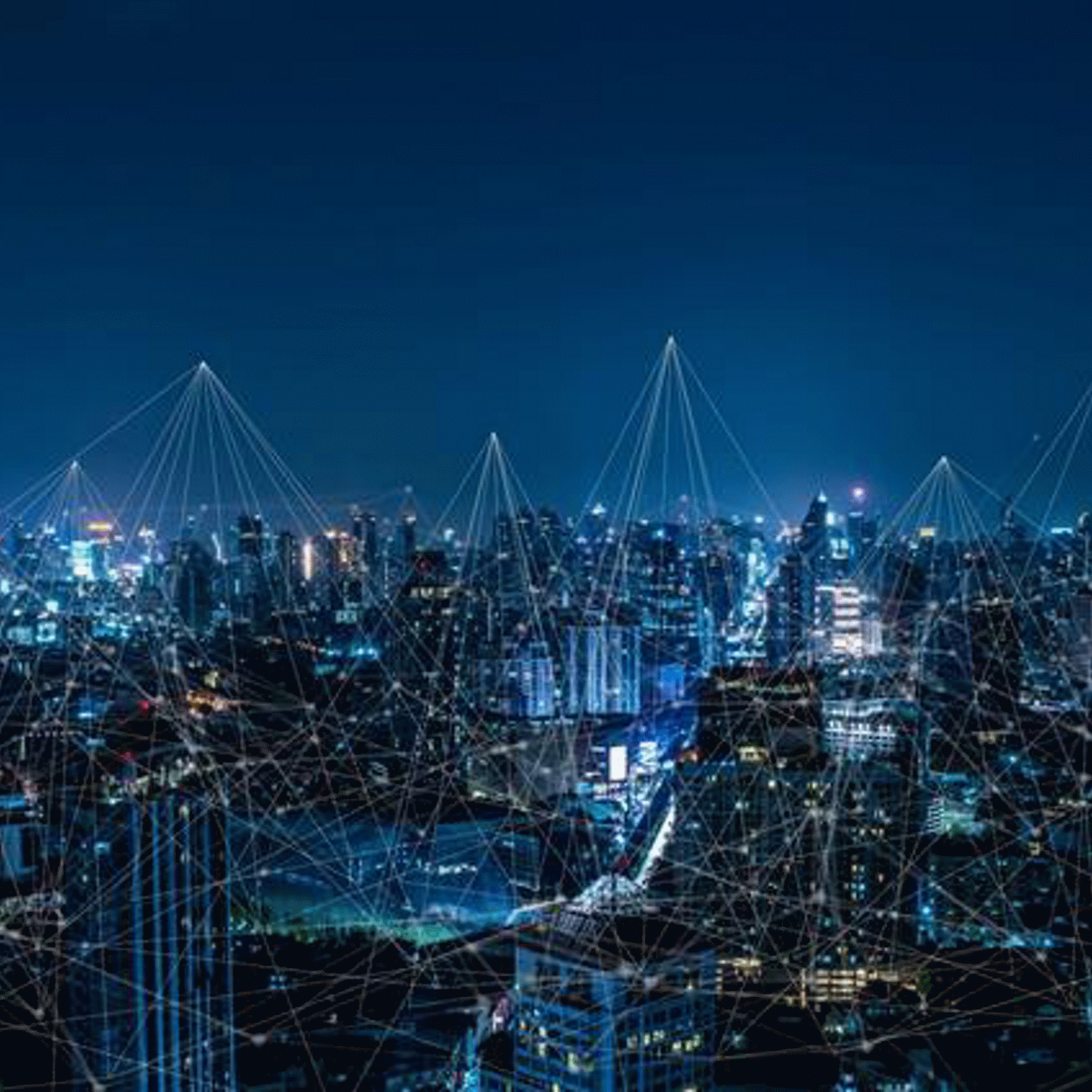 Nighttime city skyline overlaid with connected network lines.