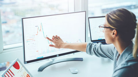 Businesswomen in Front of Desktop