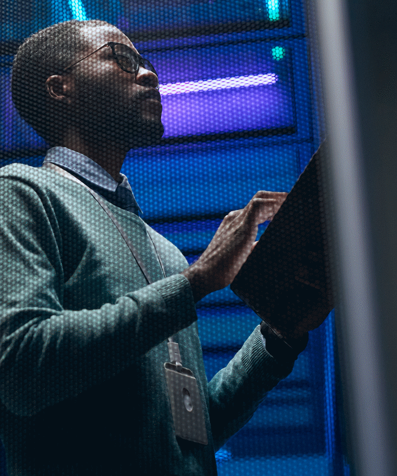 Technician managing servers with tablet