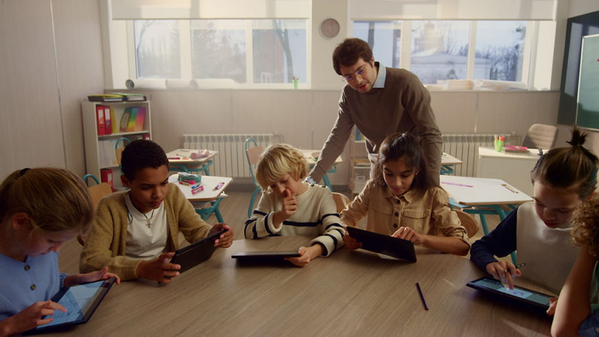 Students doing class work on digital tablets