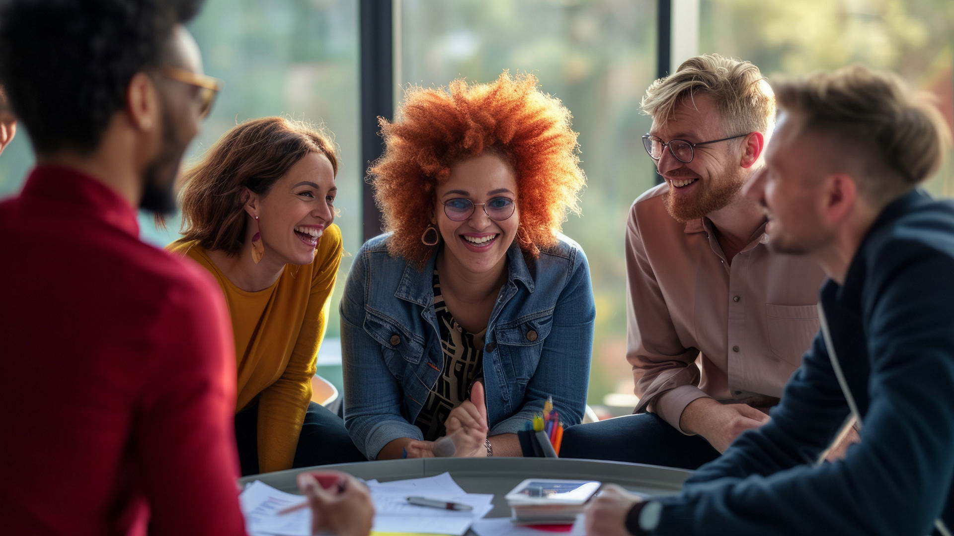 Smiling employees gathered around a table