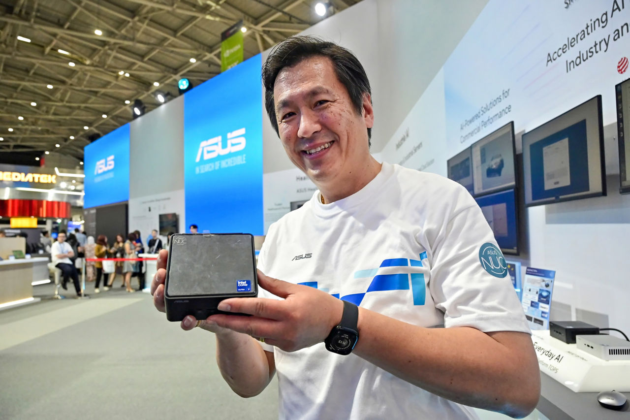 At Computex in Taipei, Taiwan, on Tuesday, May 20, 2025, Arthur Chang, product line manager in the ASUS IoT and NUC Business Unit for ASUS, displays the ASUS NUC 15 Pro, which features the latest Intel Core Ultra (Series 2) processor and launches in the second half of 2025. At Computex 2025, ASUS announced a collaboration with Intel on a new AI developer tool kit – ASUS AI Superbuild – to streamline the development of AI applications. (Credit: Intel Corporation)