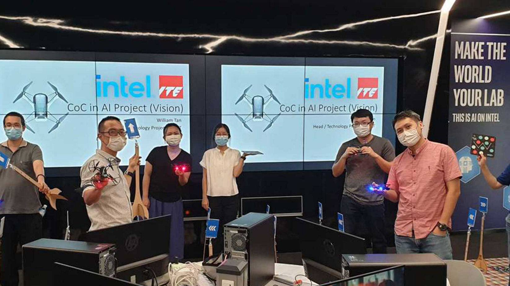 Workers present on AI in Singapore at conference