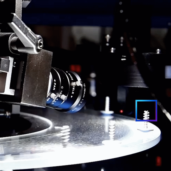 Close-up of a precision machine inspecting a circular surface