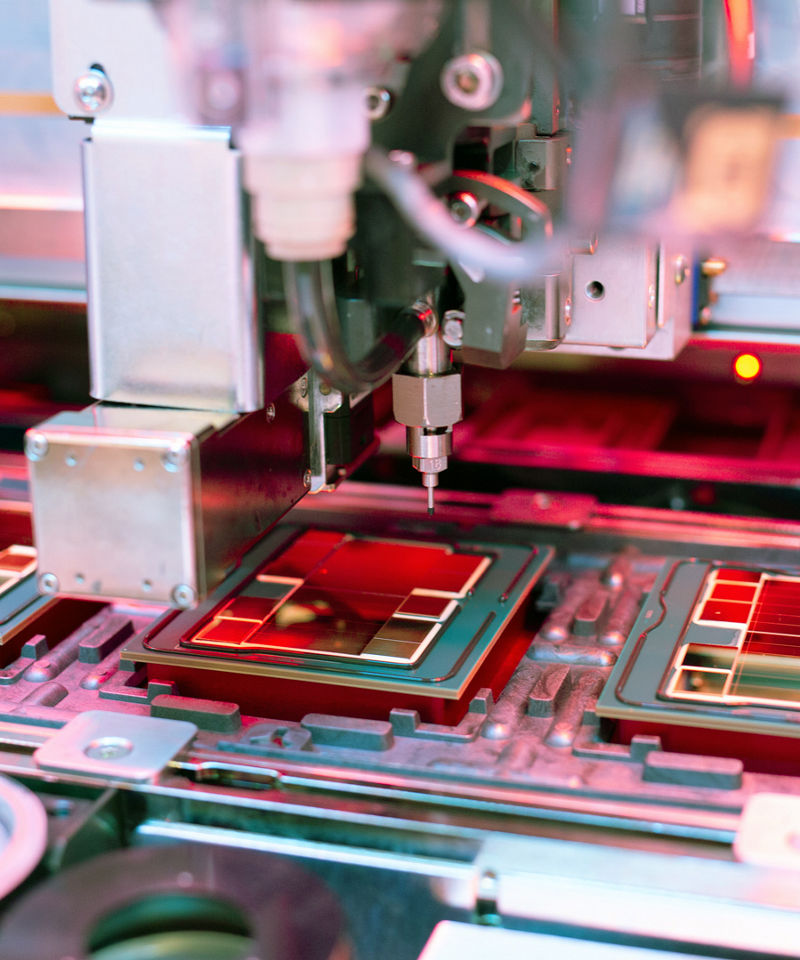 A semiconductor being manufactured on an assembly line.
