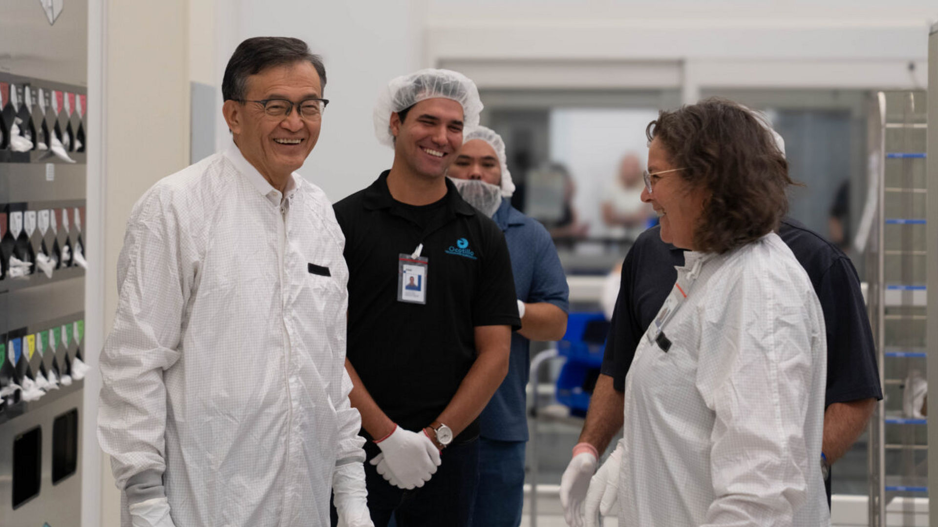 Lip-Bu Tan and Zivit Katz-Tsameret wear white cleanroom suits inside Intel Fab 52.