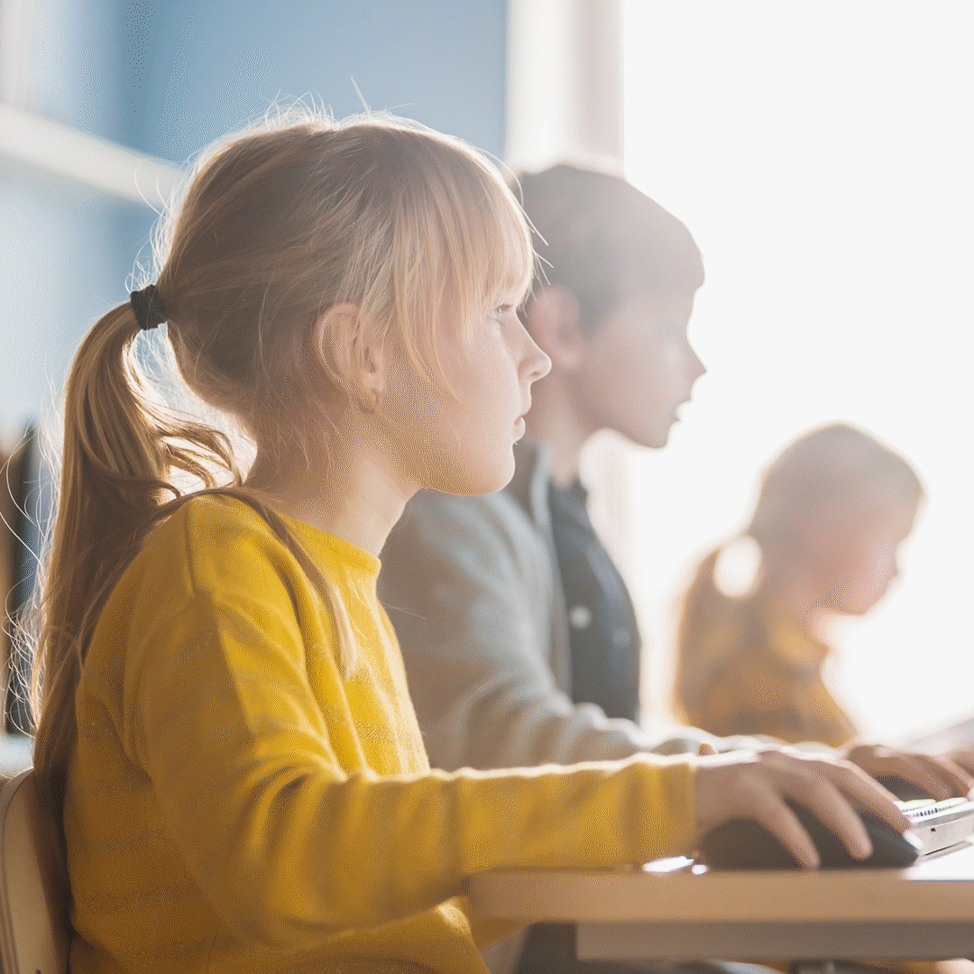 This image contains 16x9, 4x3 and 1x1 JPGs renditions suitable for online and social media. Elementary school age kids using computers in class computer lab. Derived from IDL