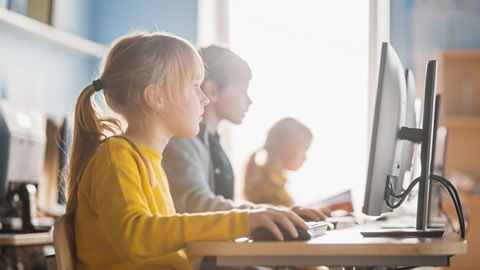 kids using computers in class computer lab rwd