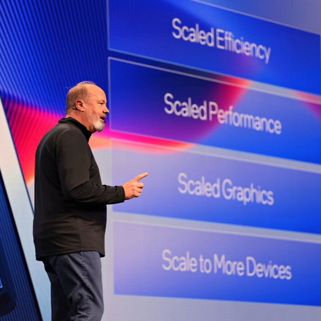 Presenter showing a performance comparison slide.