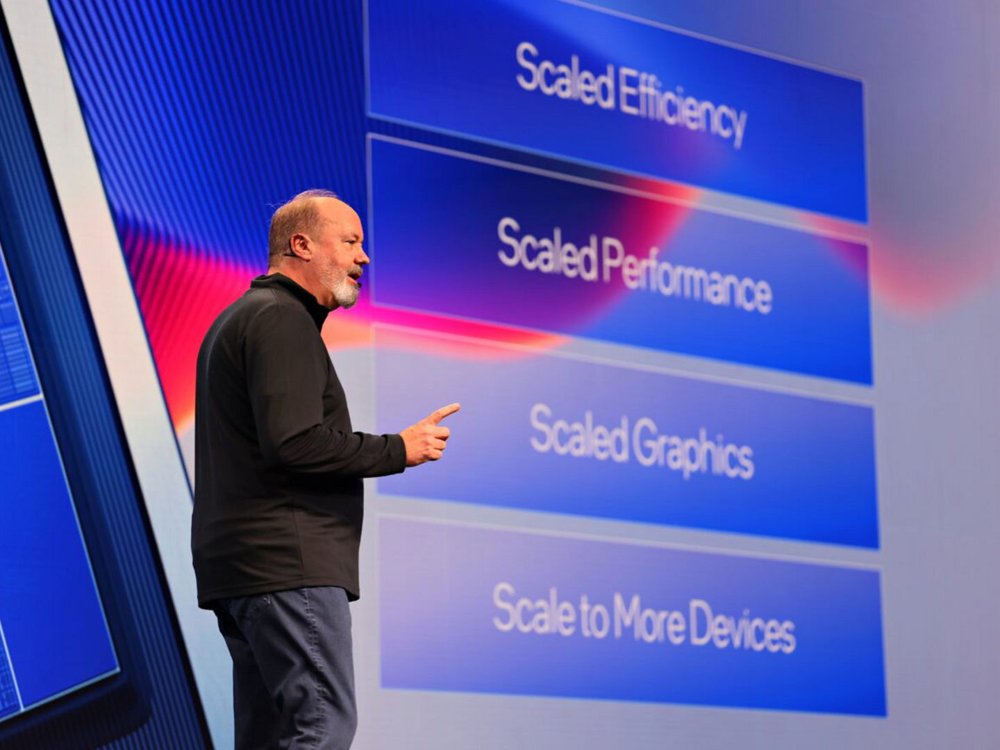 Presenter showing a performance comparison slide.