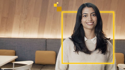 Employee with daisy-colored branded overlay