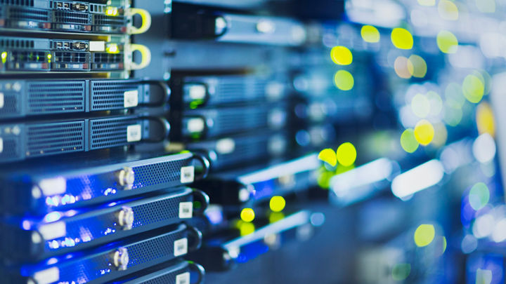 A close-up view of a server rack with multiple blue and yellow lights