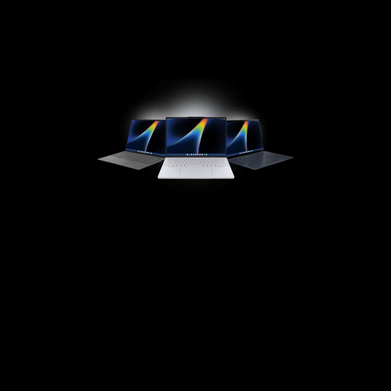 Three Googlebook PCs with black devices at an angle on each side and a silver device in the middle.