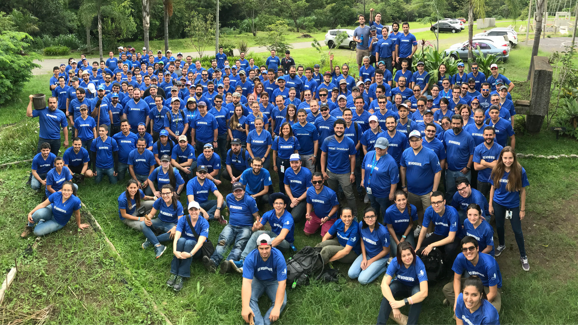 Large group of Intel employees in blue shirts.