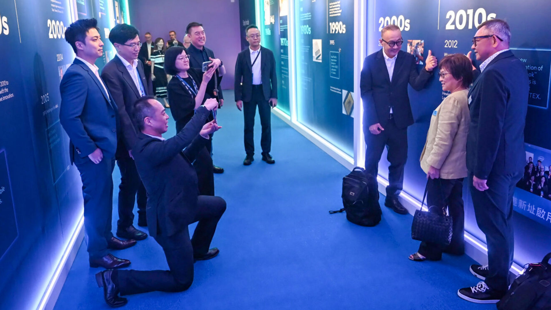 Attendees view a history timeline exhibit at the Intel Taiwan 40th anniversary event during Computex.