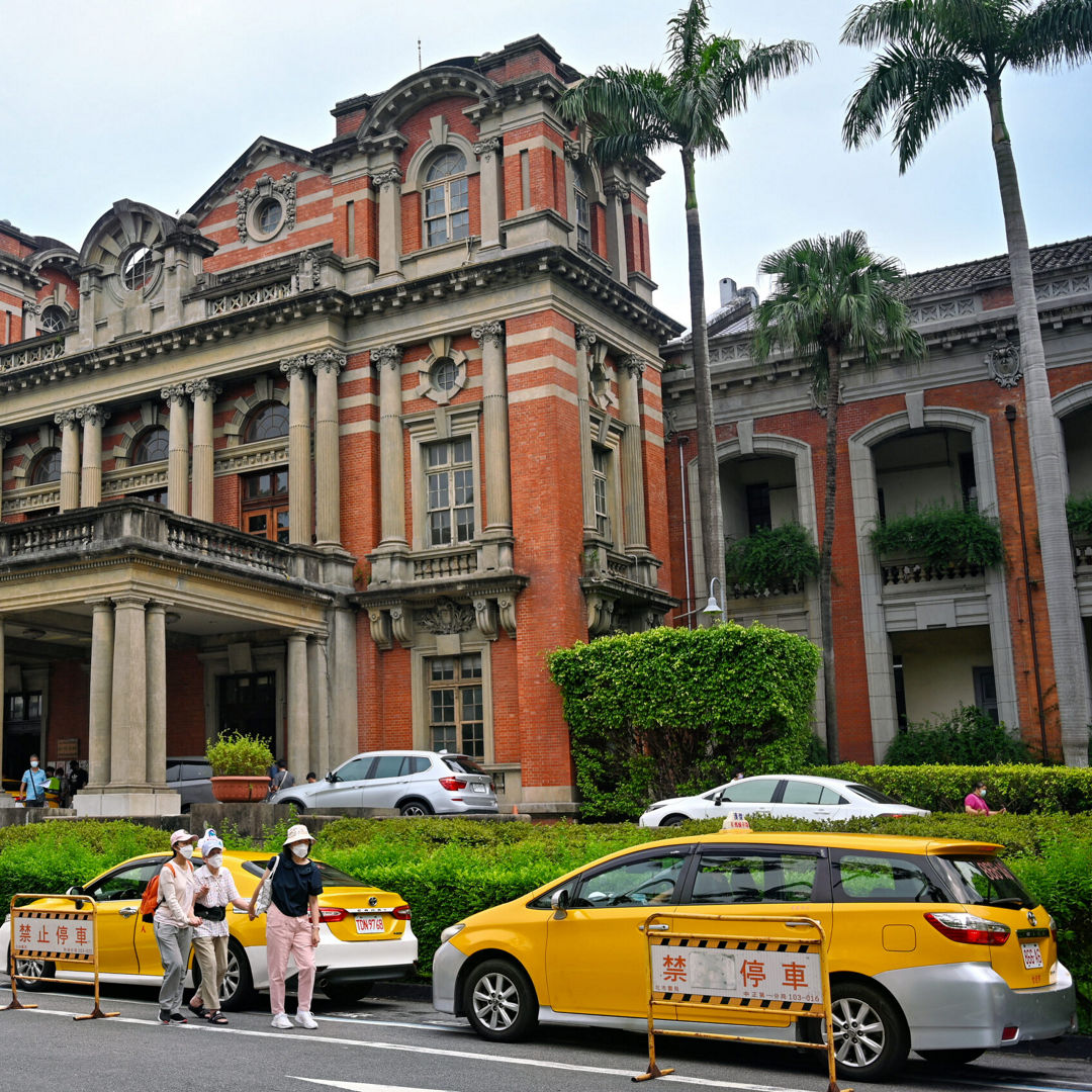 Exterior view of the historic red brick National Taiwan University Hospital building.