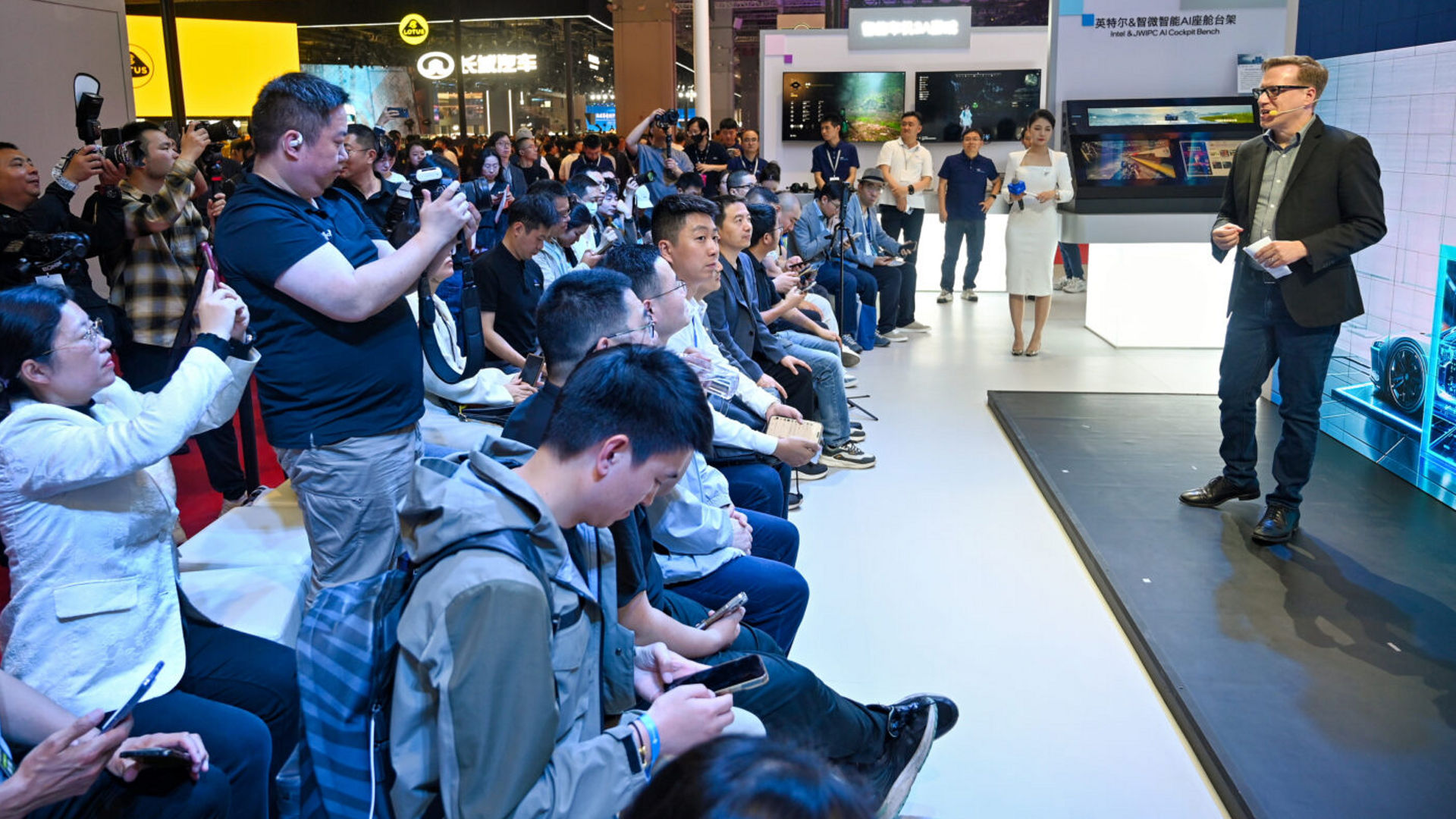 Jack Weast speaks to an audience at the Intel booth during Auto Shanghai 2025.