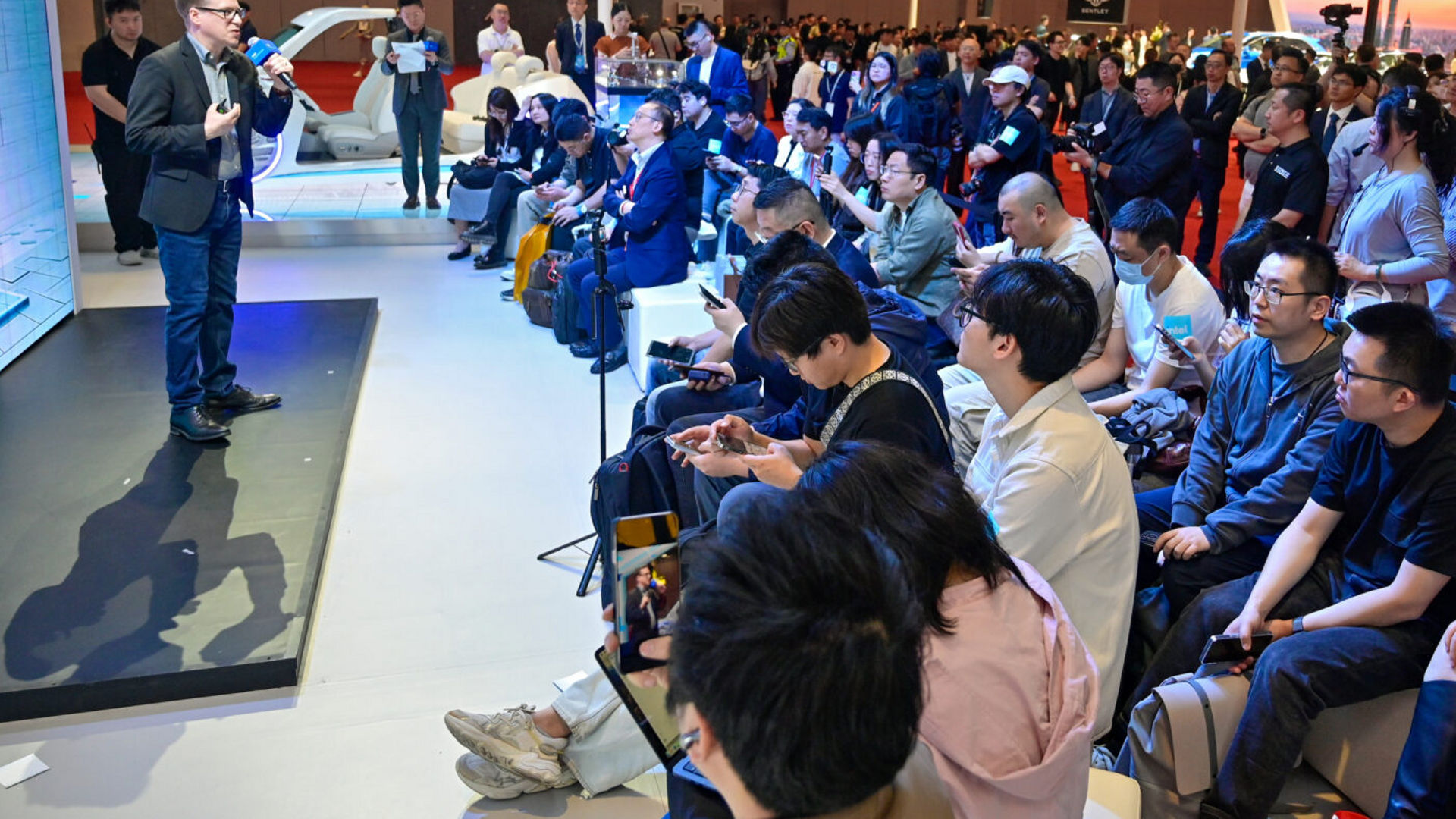 Jack Weast of Intel speaks to a large audience at the Auto Shanghai 2025 event.