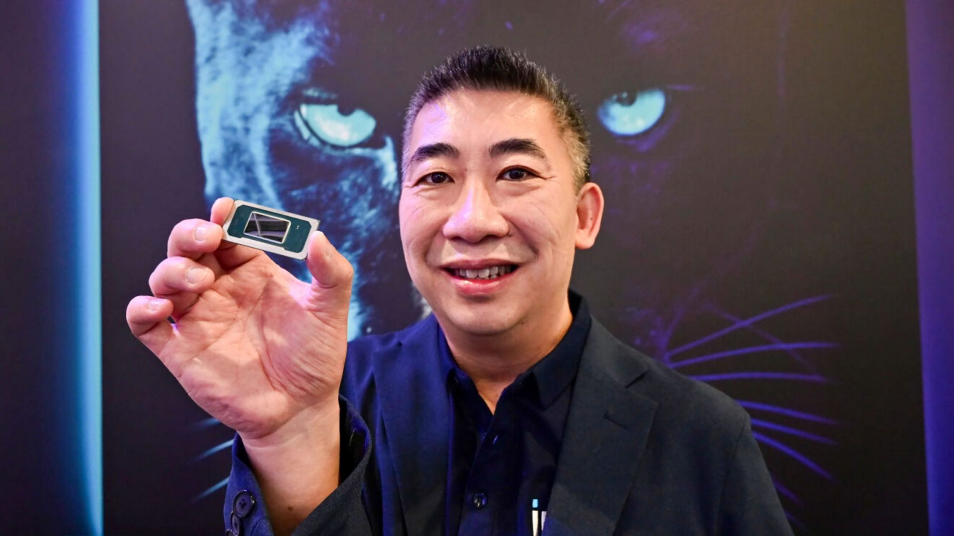 Khoi Nguyen holds a Panther Lake processor at Computex 2025.