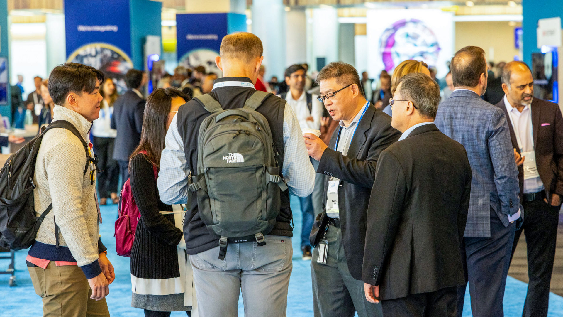 Guests and partners explore the event floor at Intel Foundry Direct Connect.