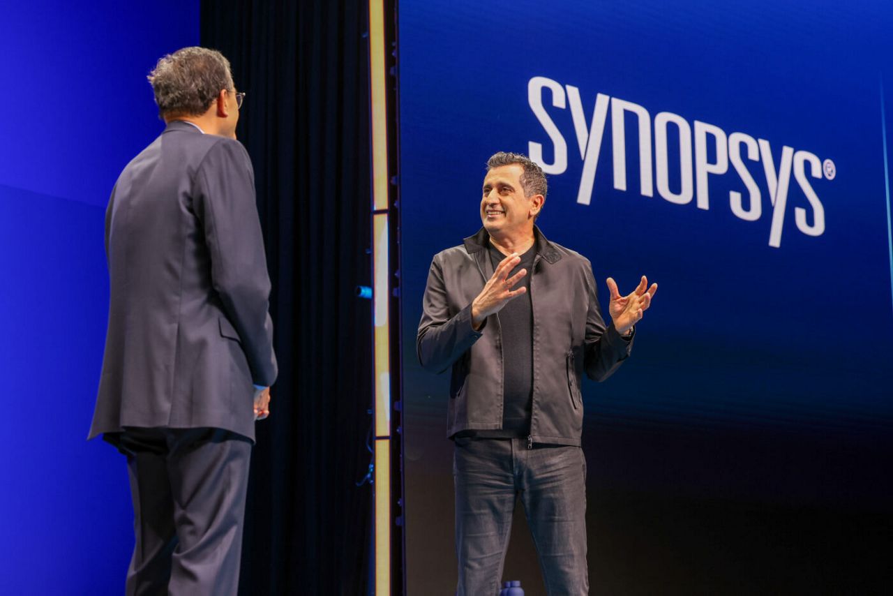 Lip-Bu Tan (left), Intel CEO, speaks with Sassine Ghazi, preside