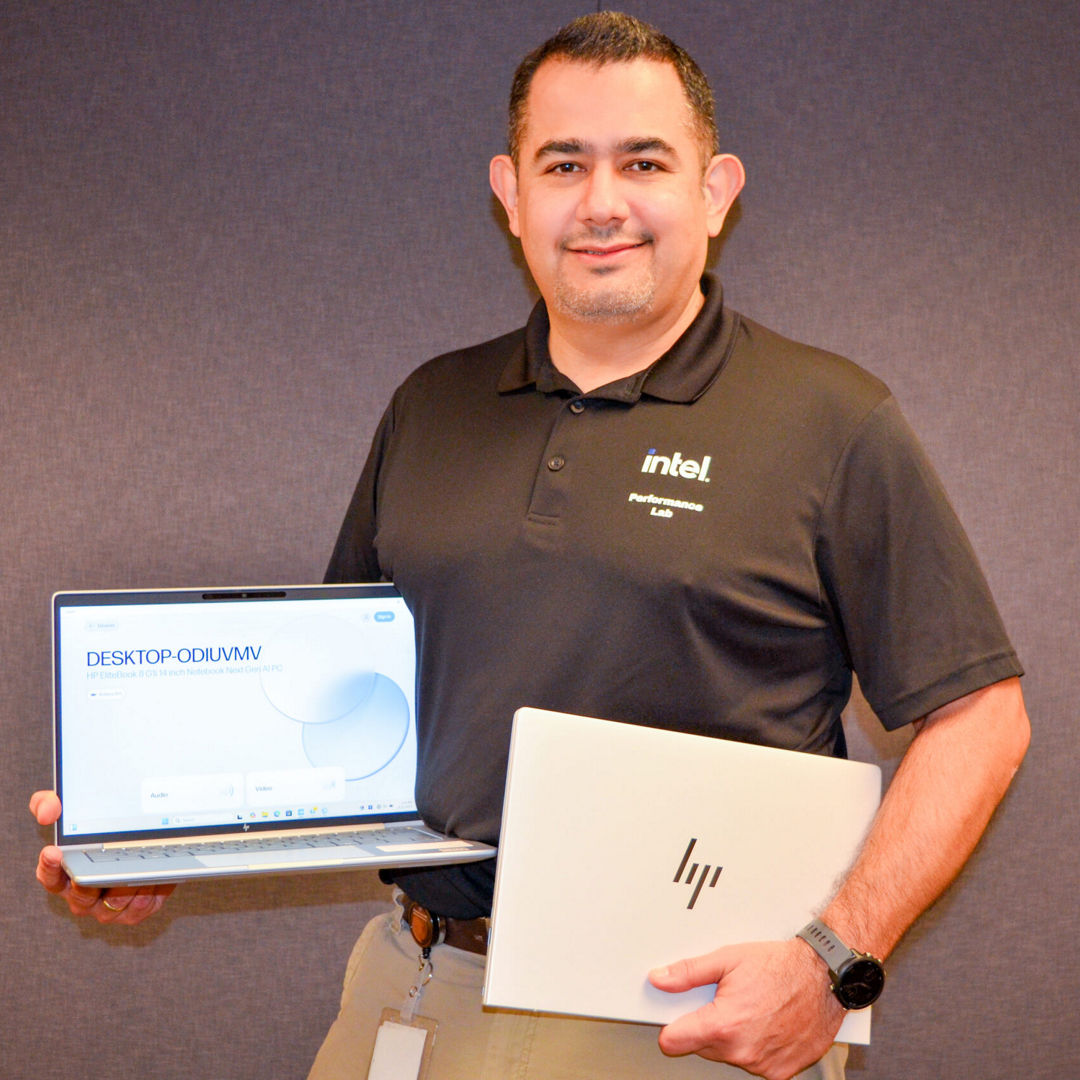 Ivan Chacon, technical marketing engineer in the Client Computing Group at Intel, poses with the HP Elitebook 8 AI PC at Intel’s Performance Marketing Lab in Santa Clara, California. (Credit: Intel Corporation)