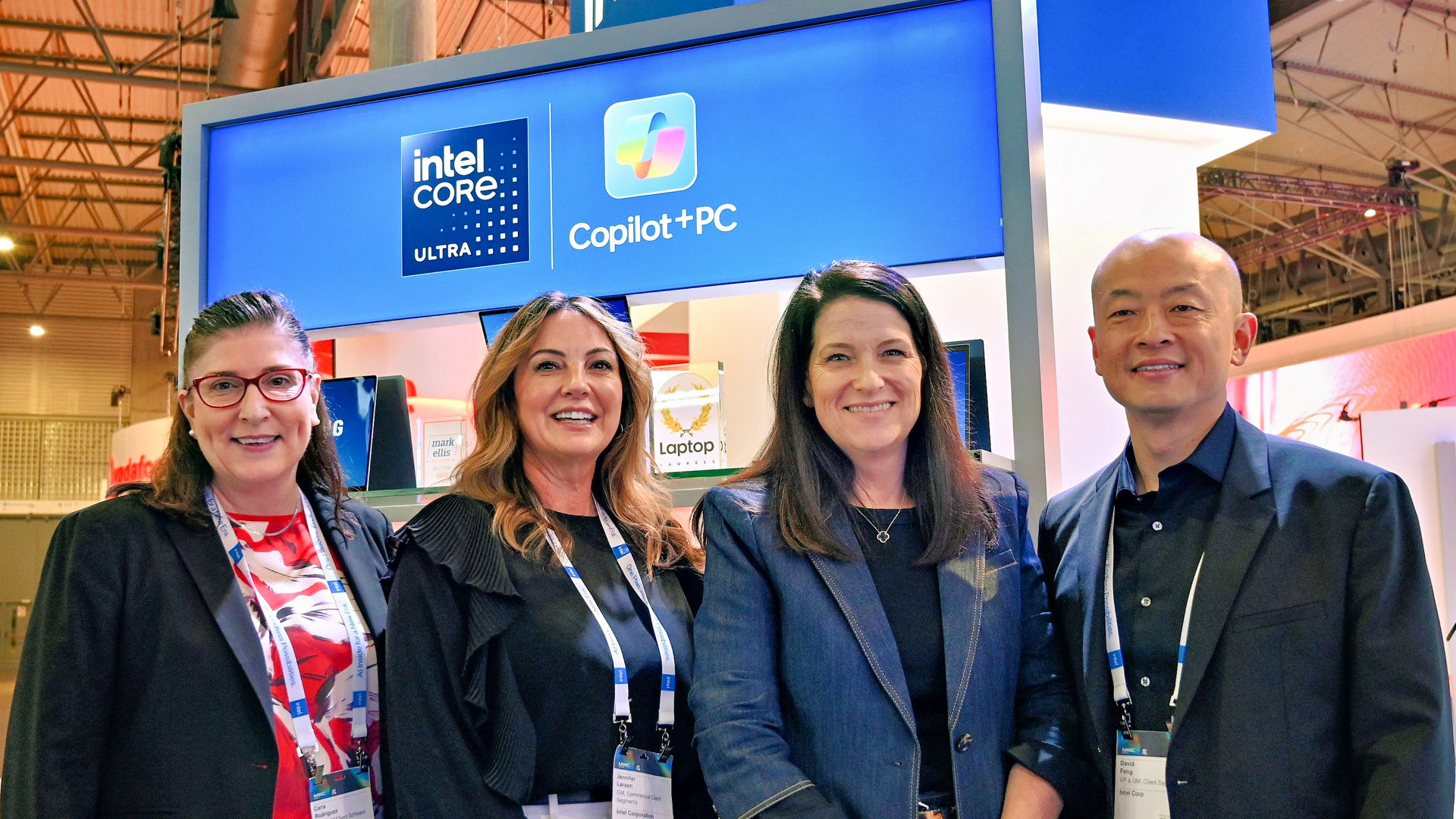 Intel leaders (from left) Carla Rodriguez, Jennifer Larson, Michelle Johnston Holthaus and David Feng pose at the Intel booth during Mobile World Congress 2025 in Barcelona, Spain. (Credit: Intel Corporation)