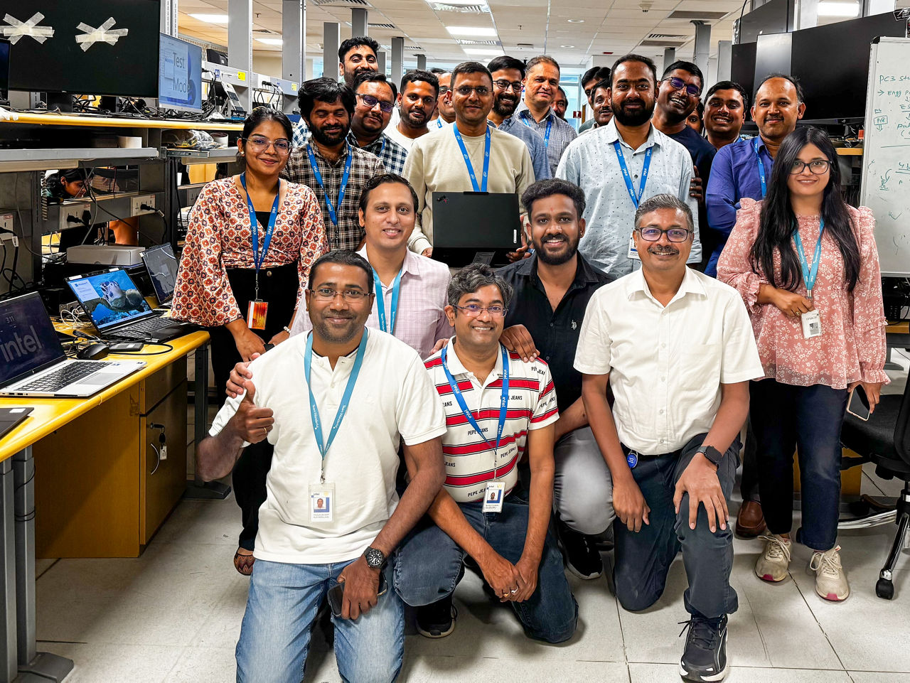 Bhavesh Shroff (center, holding the latest Lenovo Aura Edition PC), senior director of Platform Customer Engineering in the Client Computing Group at Intel, poses with the Intel team at the company’s engineering lab in Bengaluru, India, in April 2025. (Credit: Intel Corporation)