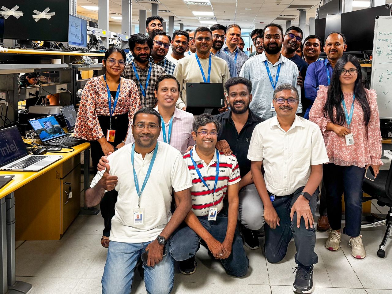Bhavesh Shroff (center, holding the latest Lenovo Aura Edition PC), senior director of Platform Customer Engineering in the Client Computing Group at Intel, poses with the Intel team at the company’s engineering lab in Bengaluru, India, in April 2025. (Credit: Intel Corporation)