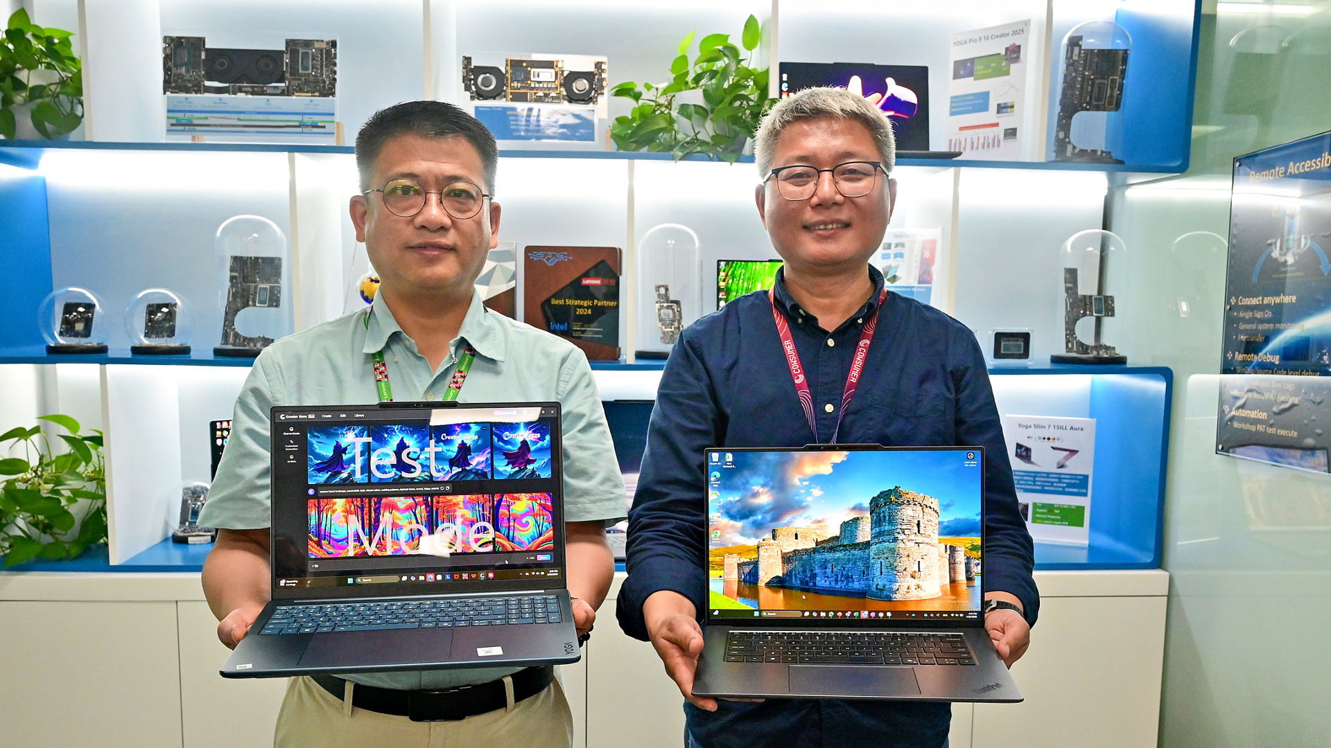 Zheng Jiong (left), senior director of Customer Engineering and Platform Center of Excellence in the Client Computing Group at Intel China, and Zhijian Mo, director of Platform Design and Development in the Intelligent Devices Group at Lenovo, show off Lenovo’s latest Aura Edition PCs in April 2025. (Credit: Intel Corporation)