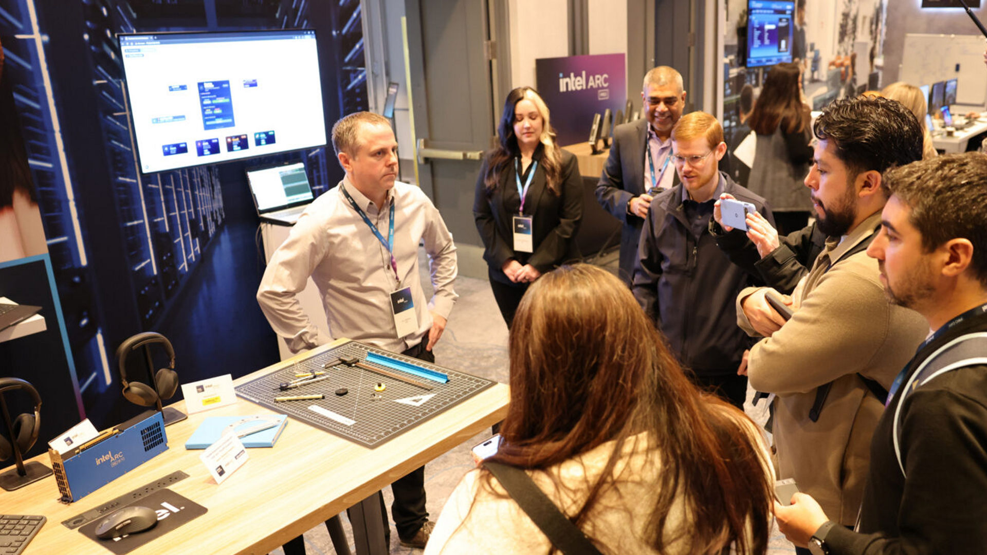 Press and industry analysts experience hands-on demonstrations of Intel vPro-enabled devices and Intel Arc Pro solutions, exploring the latest advancements in commercial PC security, AI-driven manageability, fleet management, and graphics capabilities during Intel's exclusive showcase event. (Credit: Intel Corporation)