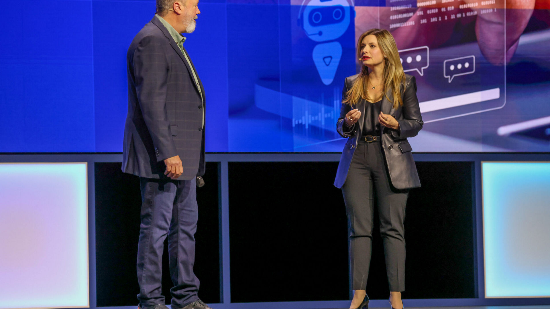 Dounia Senawi (right), Deloitte Consulting’s chief commercial officer, appears on stage with Jim Johnson, general manager of the Client Computing Group at Intel, during the Intel Vision event on Tuesday, April 1, 2025, in Las Vegas. Senawi discussed Deloitte’s strategic investment in a fleet of Intel Core Ultra AI PCs for its developers, and she reported the company has seen a 50% time savings in completing routine tasks. (Credit: Intel Corporation)