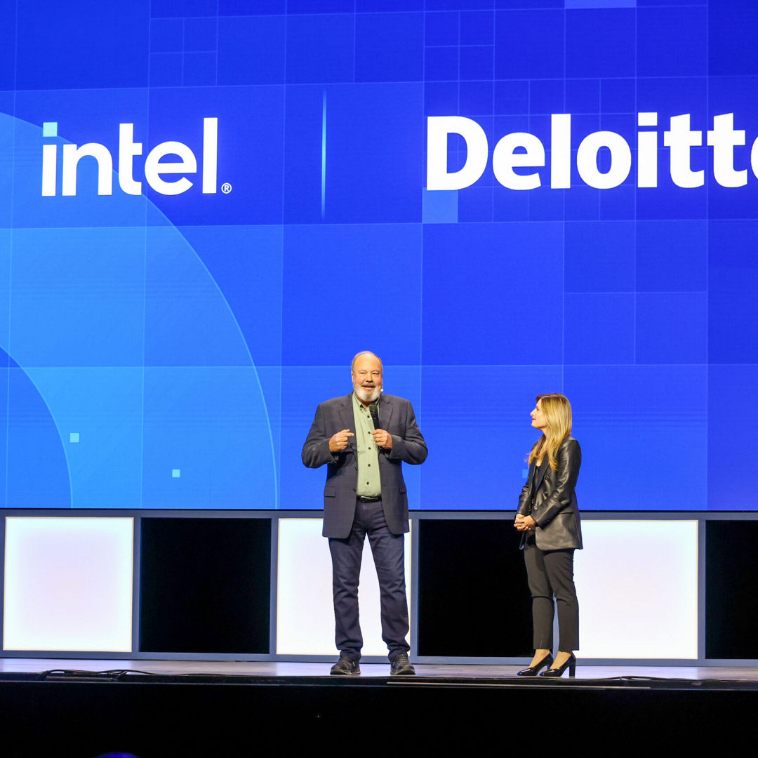 Dounia Senawi (right), Deloitte Consulting’s chief commercial officer, appears on stage with Jim Johnson, general manager of the Client Computing Group at Intel, during the Intel Vision event on Tuesday, April 1, 2025, in Las Vegas. Senawi discussed Deloitte’s strategic investment in a fleet of Intel Core Ultra AI PCs for its developers, and she reported the company has seen a 50% time savings in completing routine tasks. (Credit: Intel Corporation)