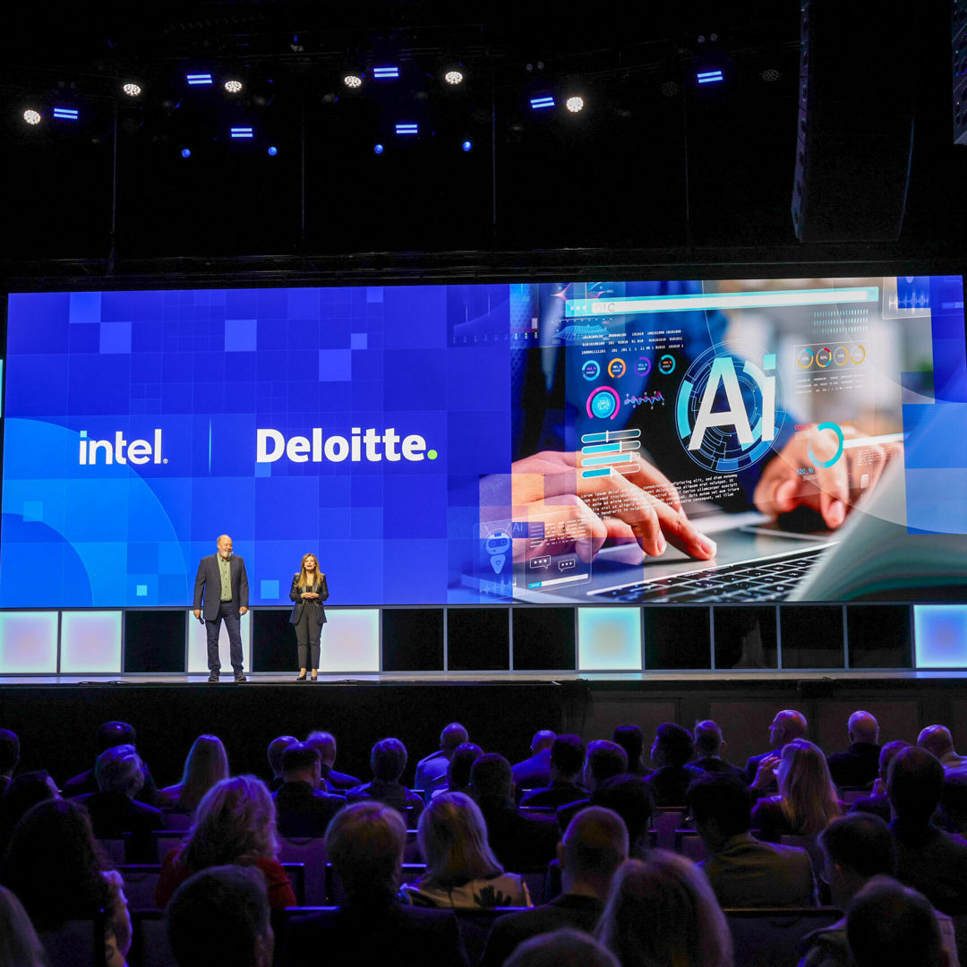 Dounia Senawi (right), Deloitte Consulting’s chief commercial officer, appears on stage with Jim Johnson, general manager of the Client Computing Group at Intel, during the Intel Vision event on Tuesday, April 1, 2025, in Las Vegas. Senawi discussed Deloitte’s strategic investment in a fleet of Intel Core Ultra AI PCs for its developers, and she reported the company has seen a 50% time savings in completing routine tasks. (Credit: Intel Corporation)