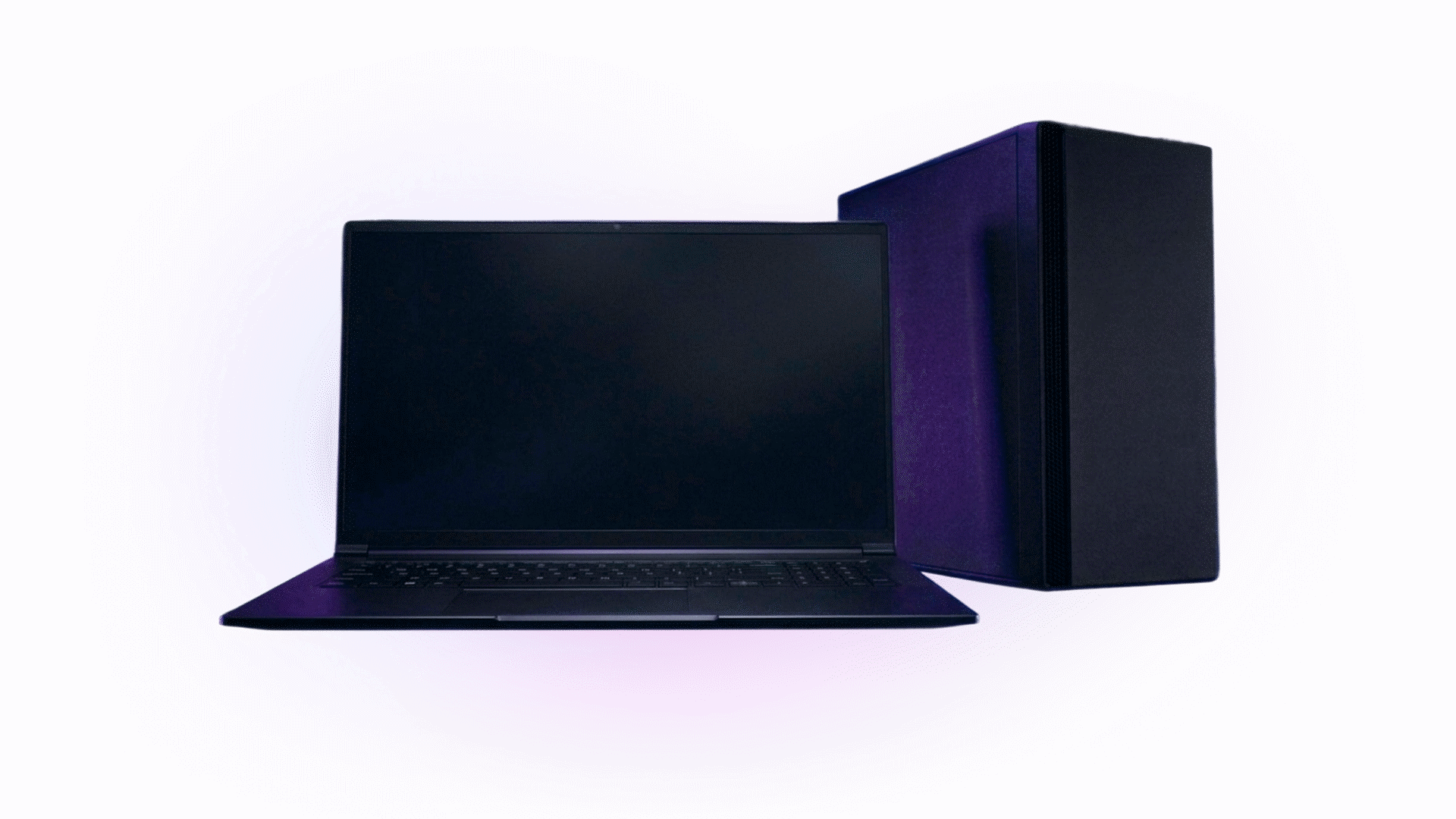 Laptop next to a desktop PC tower