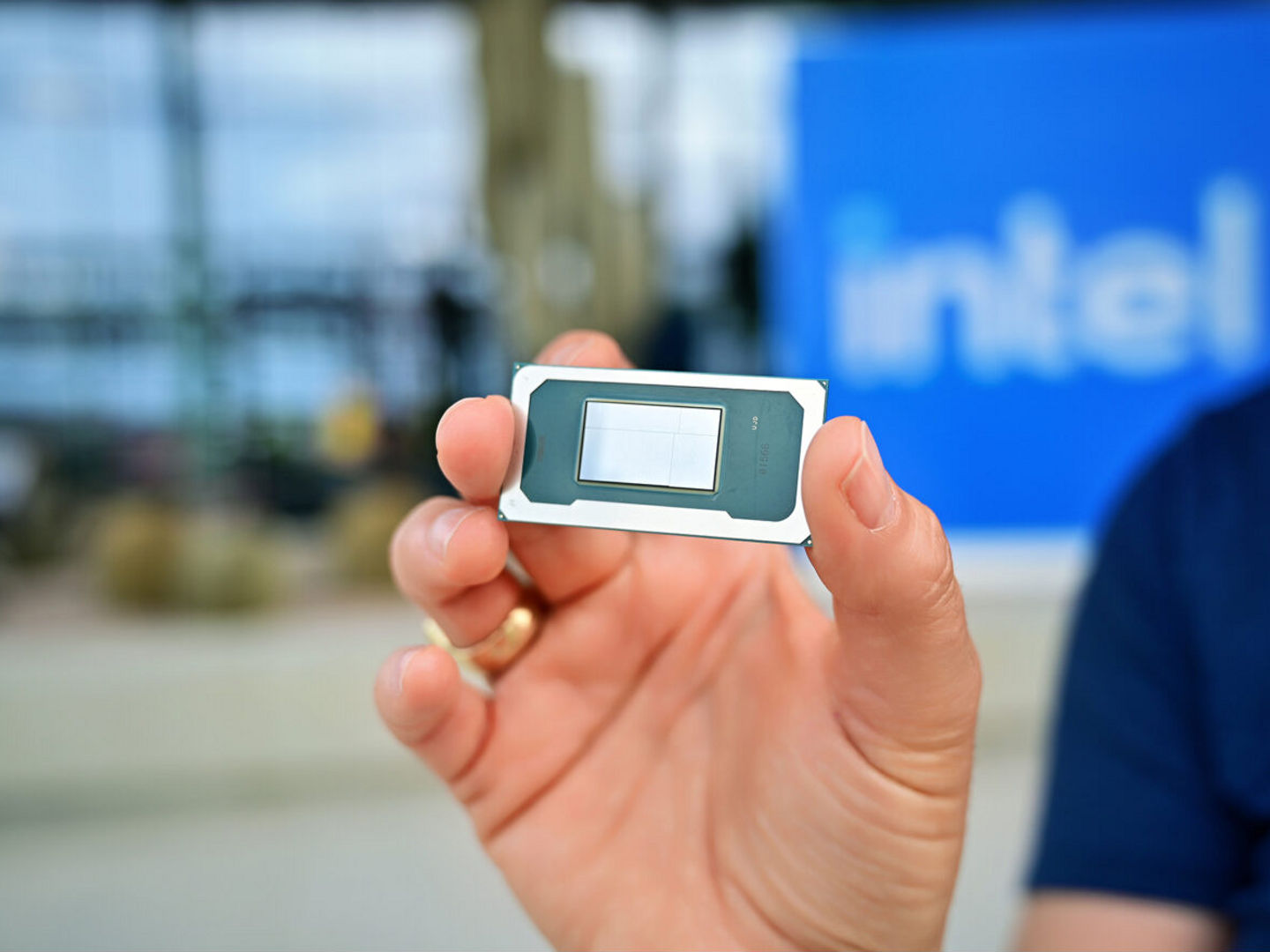 Hand holding an Intel Core Ultra Series 3 processor.