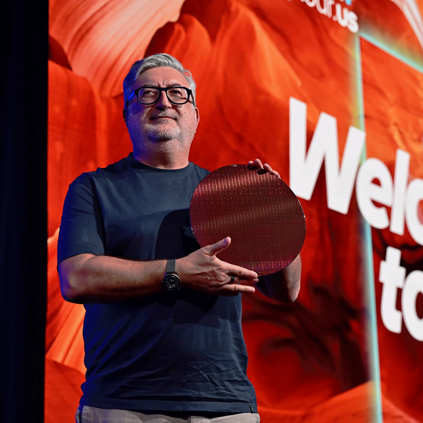 Kevork Kechichian, Executive Vice President and General Manager of the Data Center Group, holds a Clearwater Forest wafer at the Intel Tech Tour in Arizona, USA.