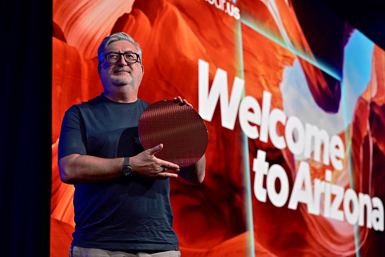 Kevork Kechichian, Executive Vice President and General Manager of the Data Center Group, holds a Clearwater Forest wafer at the Intel Tech Tour in Arizona, USA.