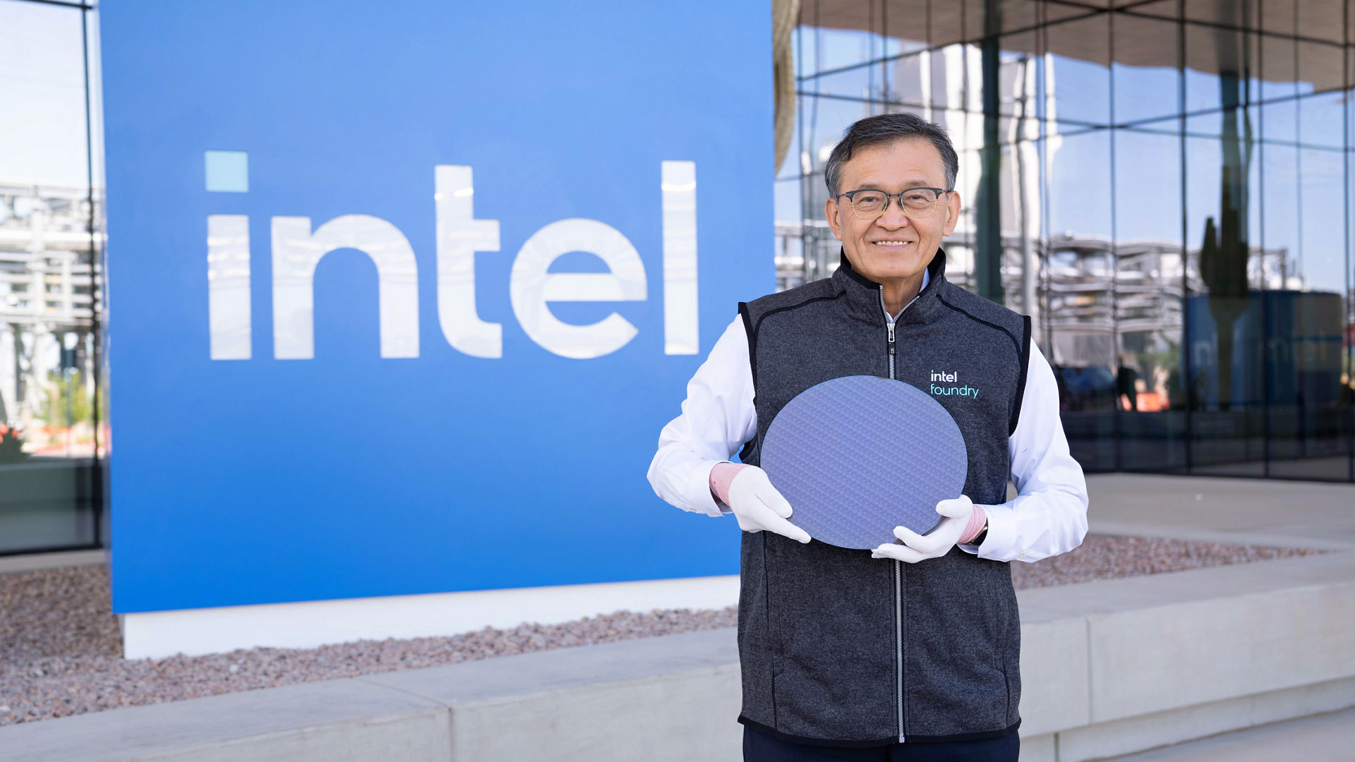 Lip-Bu Tan holds a Panther Lake wafer at Intel’s Ocotillo campus.