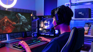 A user playing a game on a desktop computer
