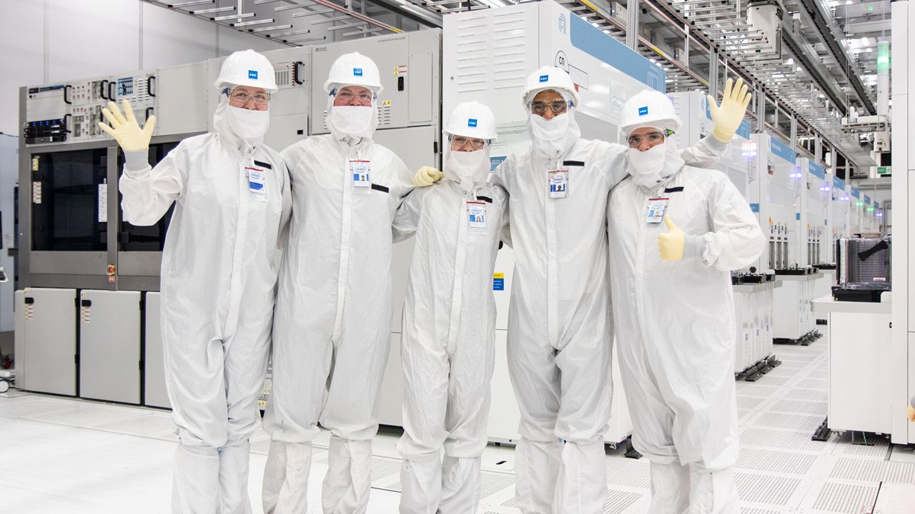 Image of 5 Intel Ireland employees wearing clean suits.