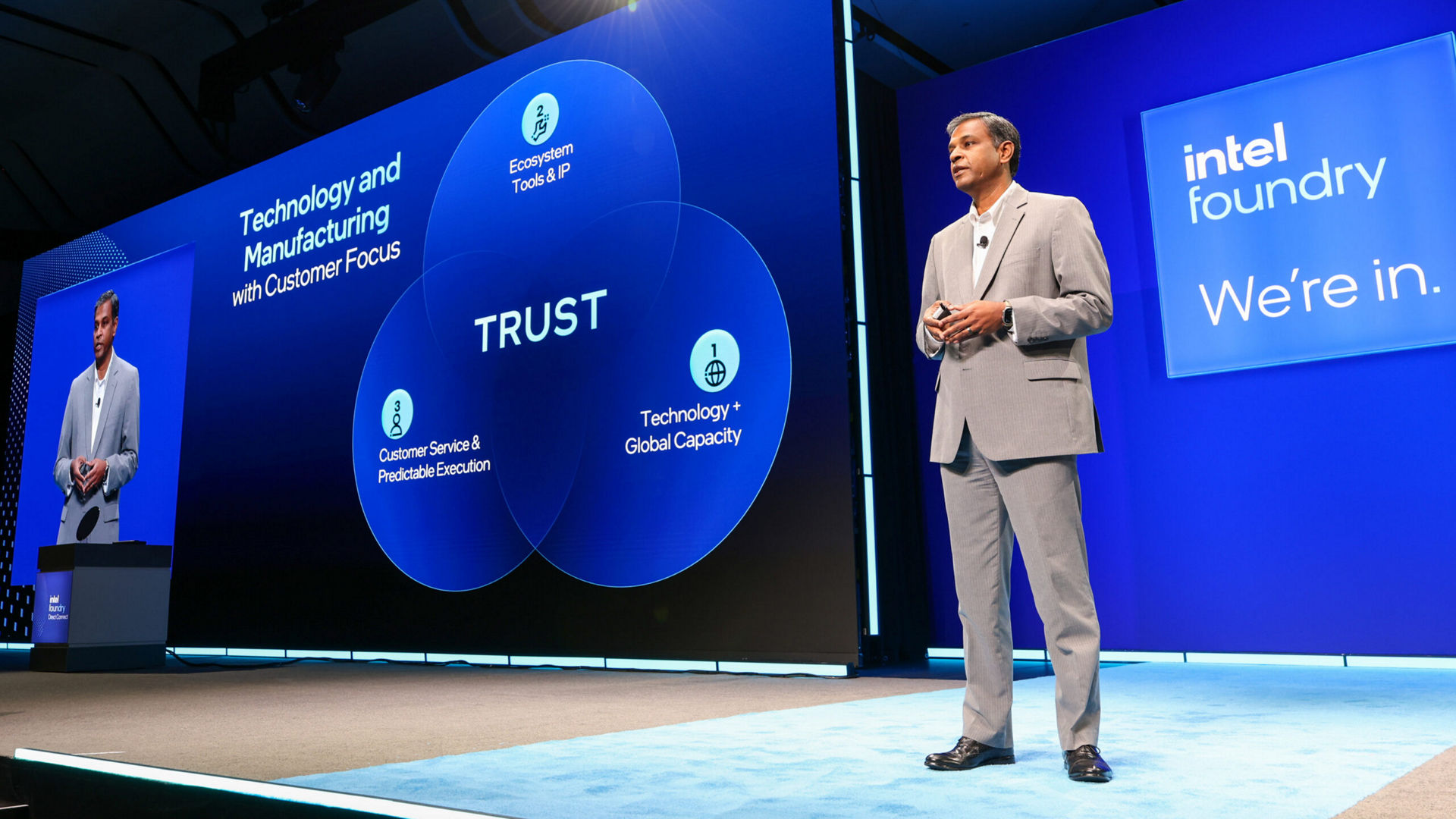 Naga Chandrasekaran presenting on stage at the Intel Foundry Direct Connect event.