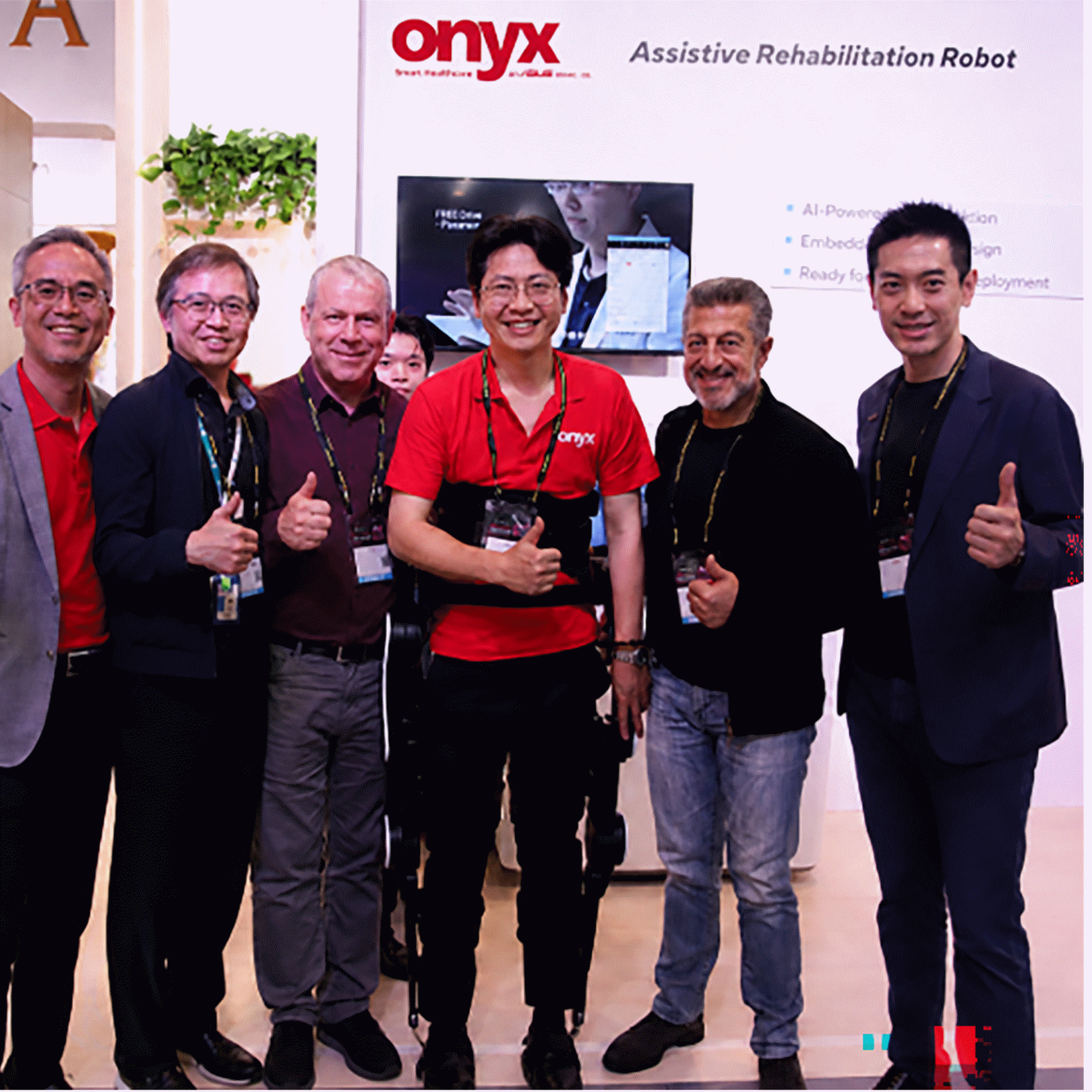 Intel, Onyx Healthcare and FREE Bionics leaders pose with the FREE Walk exoskeleton at Computex Taiwan 2026.