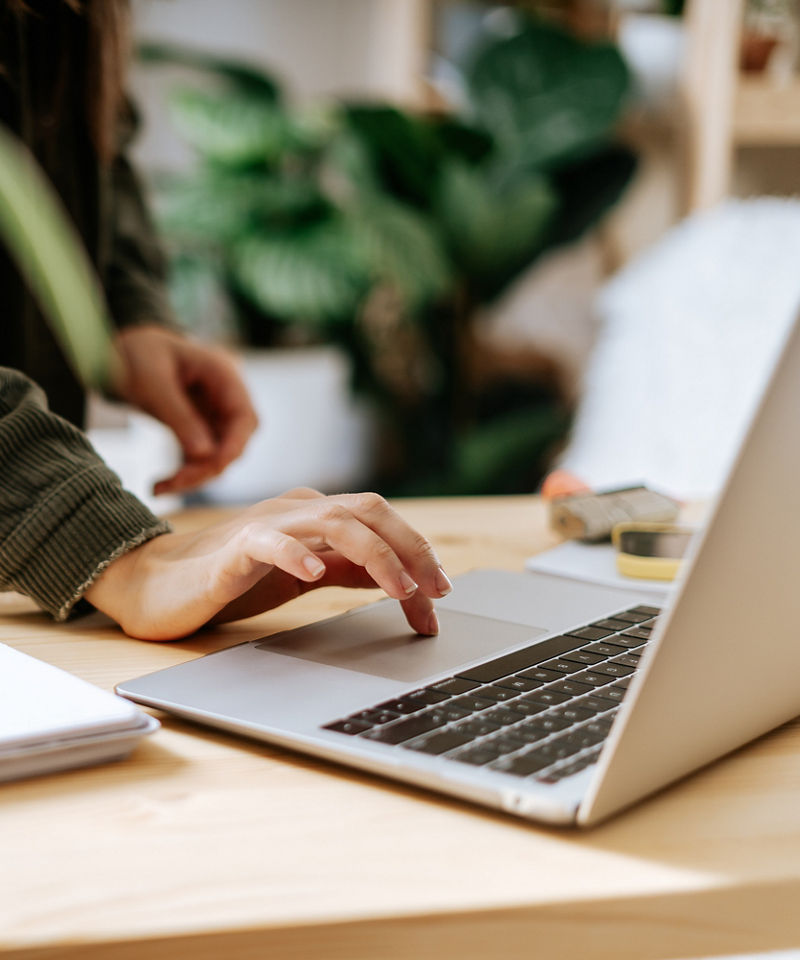 An office worker typing on a laptop.