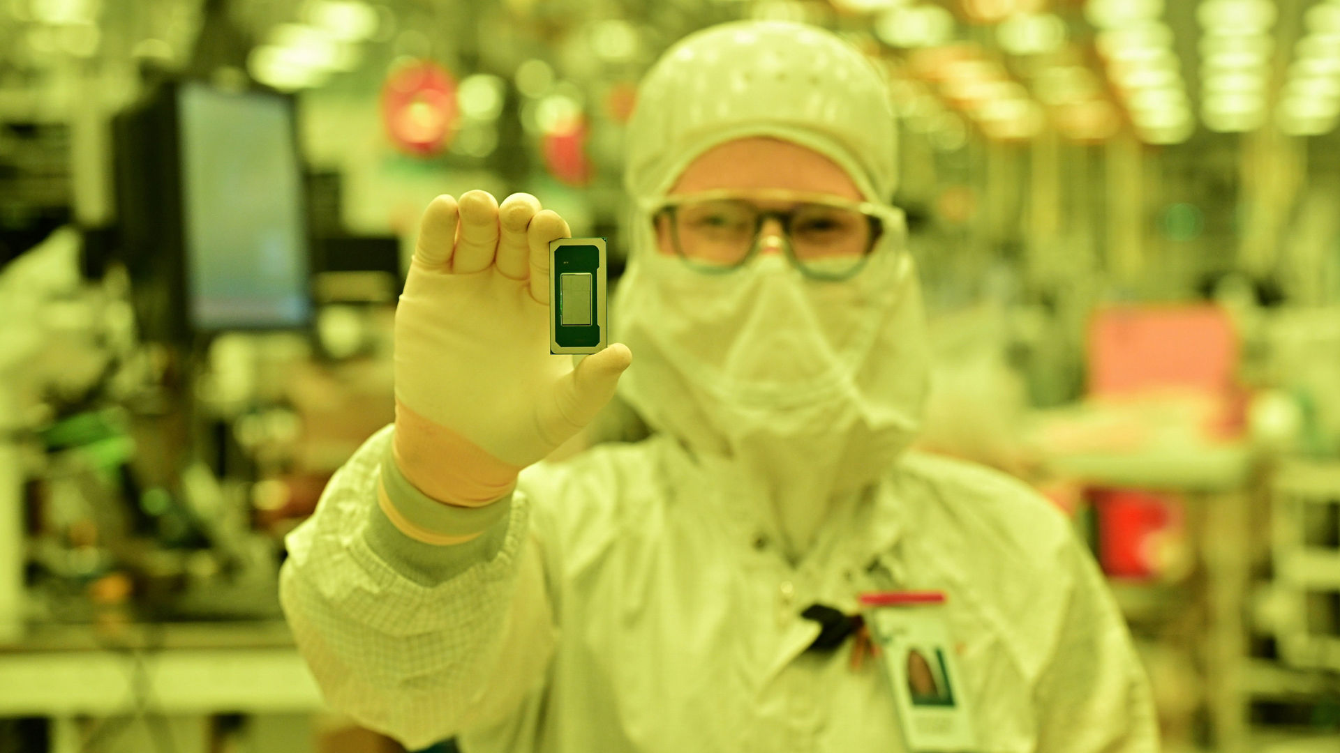 Technician holds an Intel Core Ultra series 3 processor.