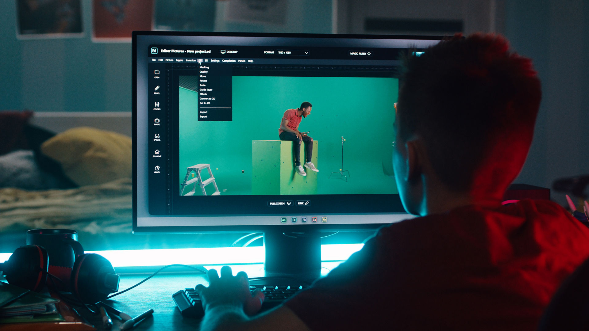 Teenager using 3D software on computer