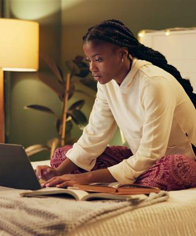Women on Laptop in Bed