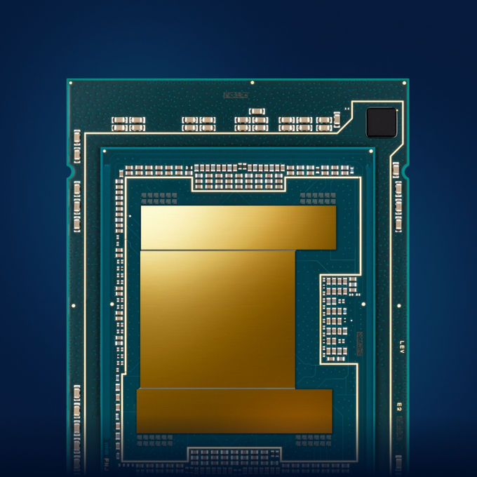 Close-up of a processor chip mounted on a circuit board, showing metallic contacts and traces against a dark background.
